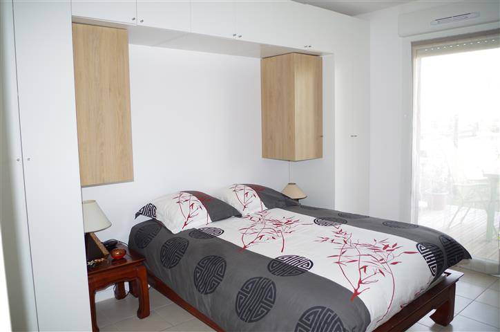 Appartement T2 en RDC CANEJAN  RDC avec jardinet et terrasse en bois